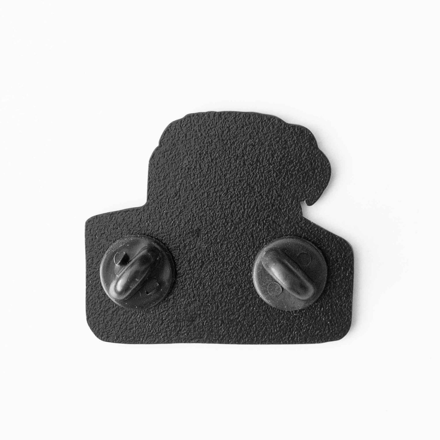 The back of a soft enamel pin with two rubber stoppers.
