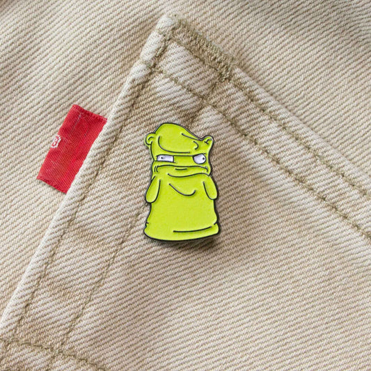 A soft enamel pin of a melted Kuchi Kopi, from the animated series Bob's Burgers.