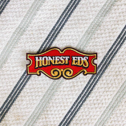 An iron-on patch of the iconic Honest Ed's store sign, a landmark discount store in Toronto, Ontario, Canada.