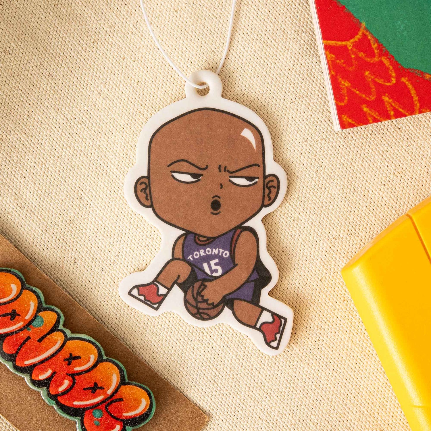 An air freshener that is in the design of the legendary Toronto Raptors basketball player, Vince Carter.