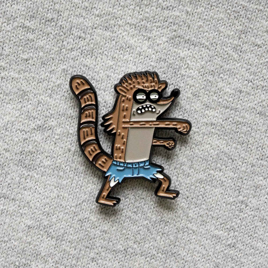 A soft enamel pin of Rigby, from the animated series Regular Show, in his Death Kwon Do outfit.