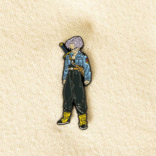 An enamel pin of the Dragon Ball Z anime character, Future Trunks. He is seen sporting his iconic jean jacket with a sword strapped to his back.