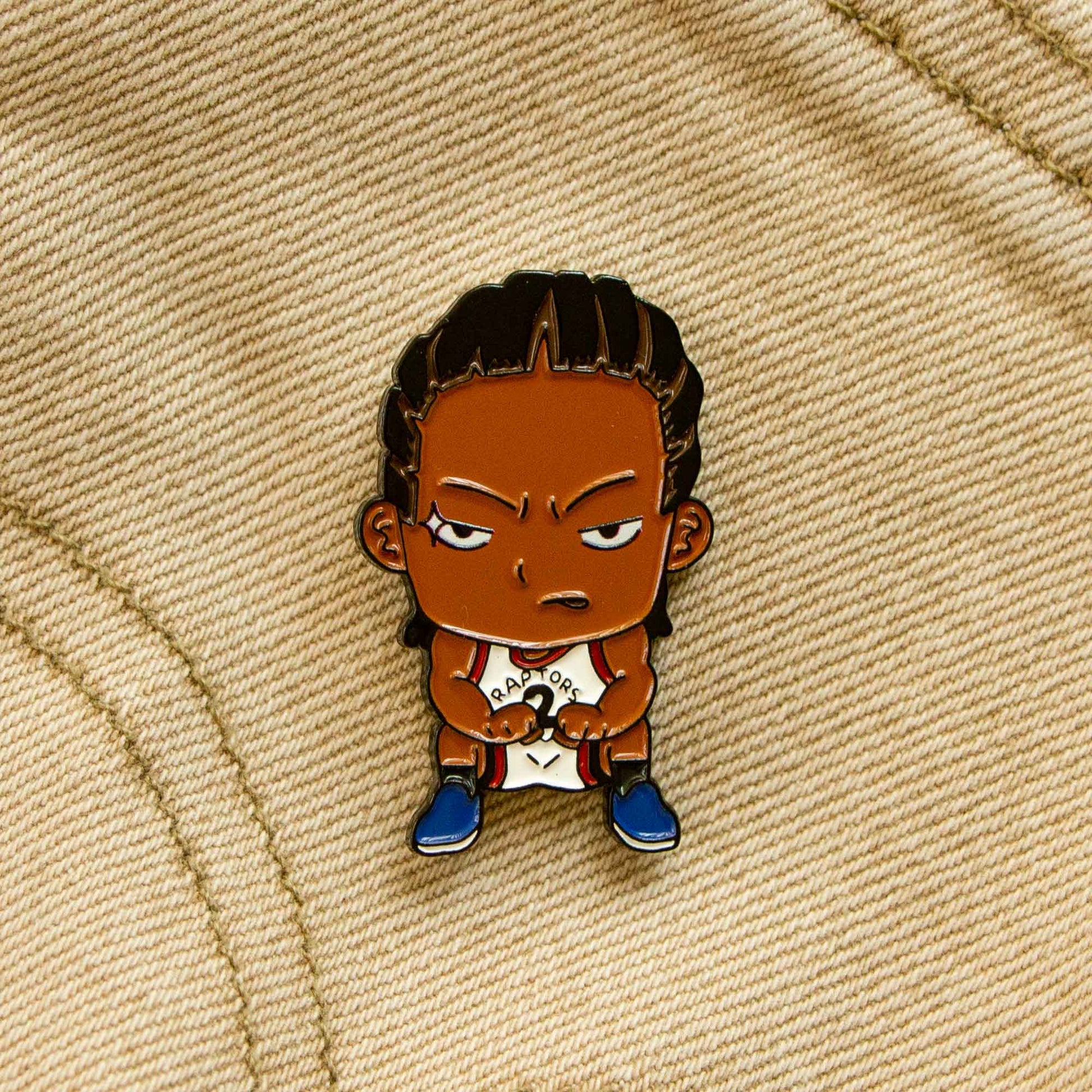An enamel pin of the Kawhi Leonard squat from the game 7 buzzer beater against the Philadelphia 76ers.